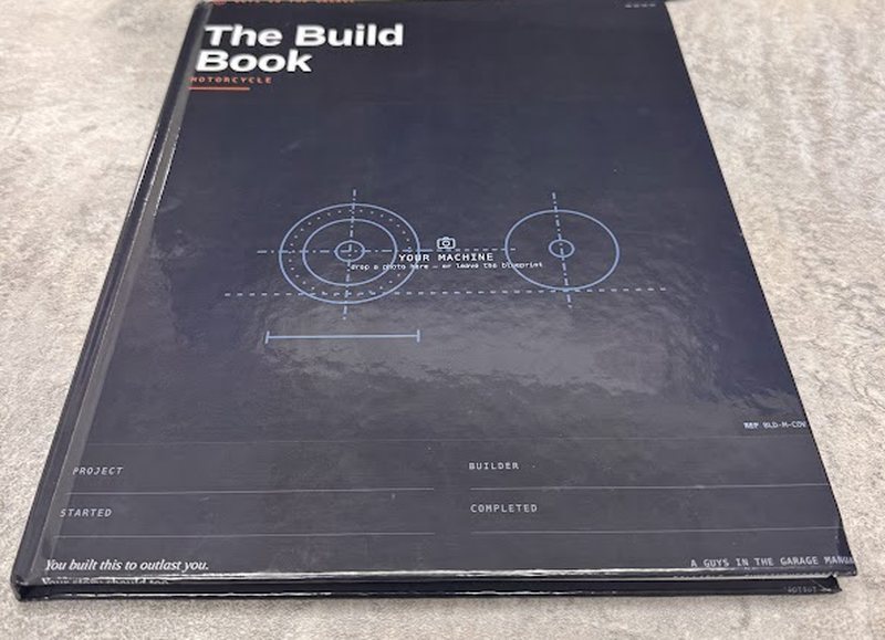 The hardcover Build Book closed, showing the front cover
